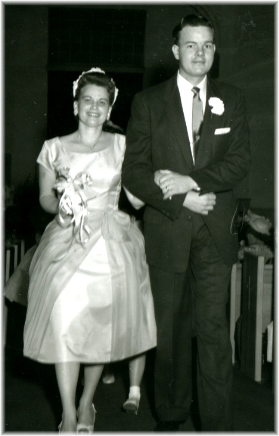 black and white photo of a happy couple on their wedding day in the early1950's