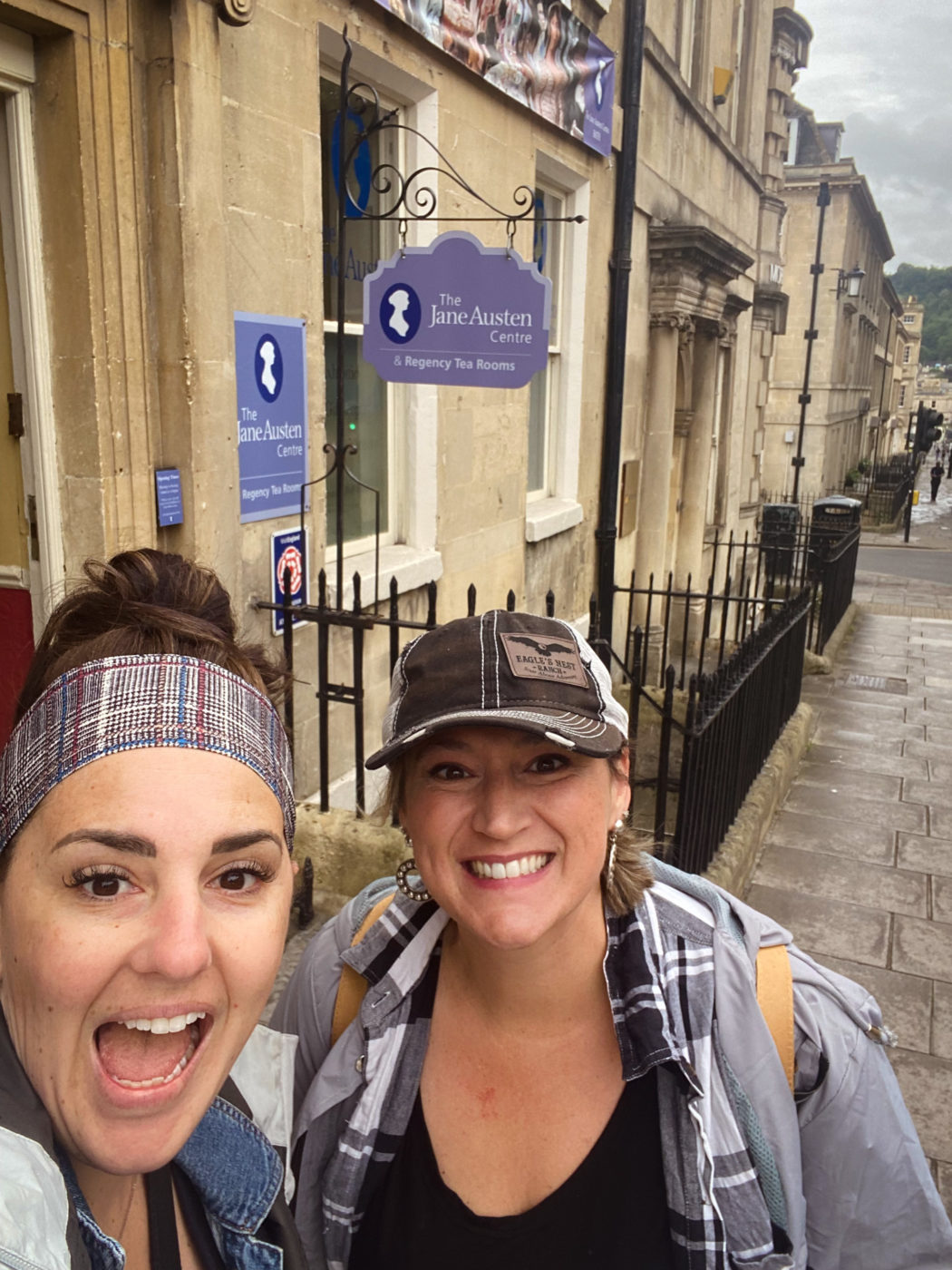 Two women outside the Jane Austen Centre